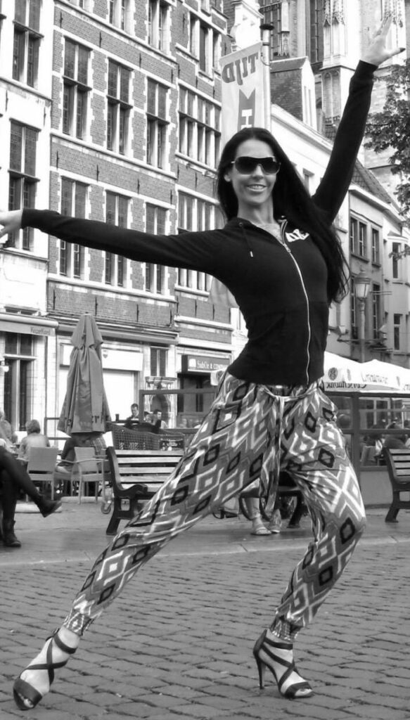 Woman dancing in the street - dance therapy music therapy